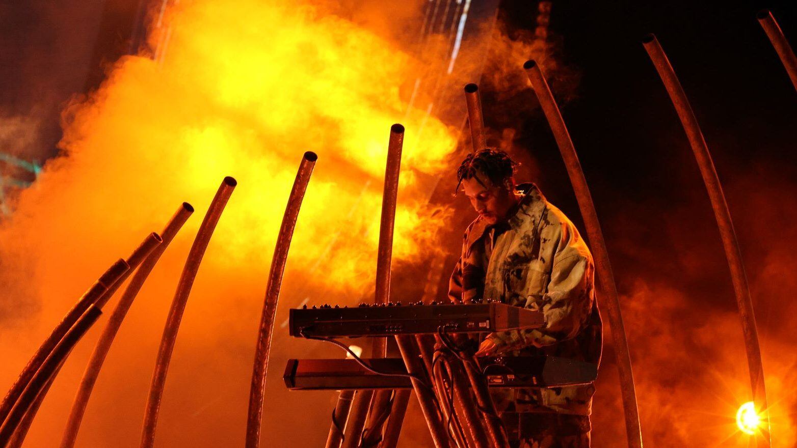 Tainy performs onstage during the 2021 American Music Awards at Microsoft Theater. Kevin Winter / Getty Images for MRC