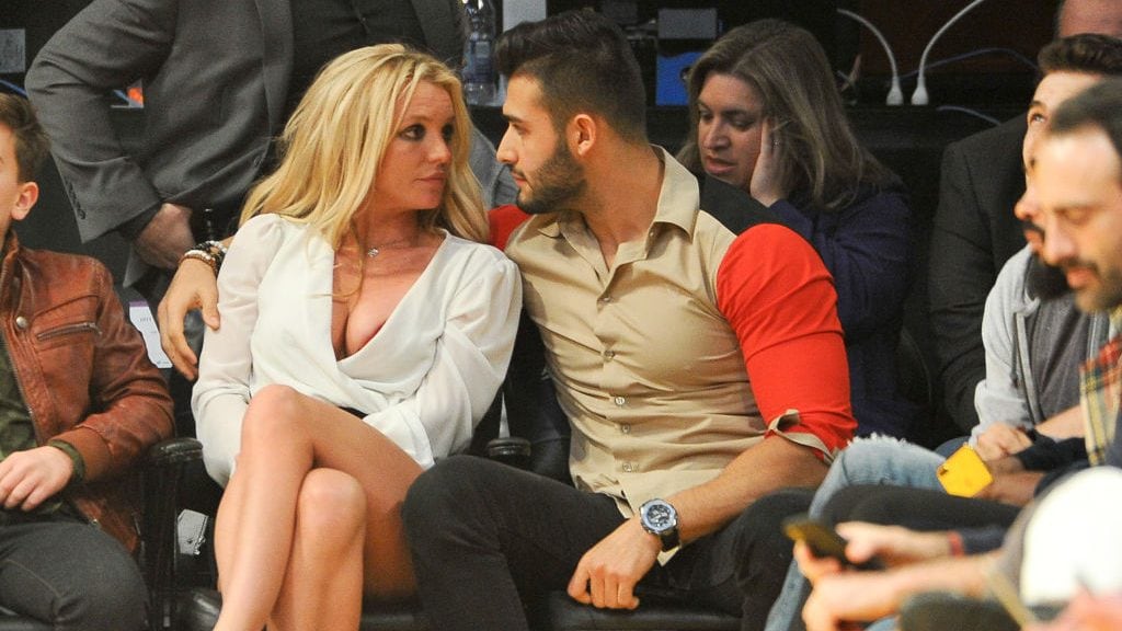 Britney Spears and Sam Asghari attend a basketball game between the Los Angeles Lakers and the Golden State Warriors at Staples Center. Allen Berezovsky/Getty Images