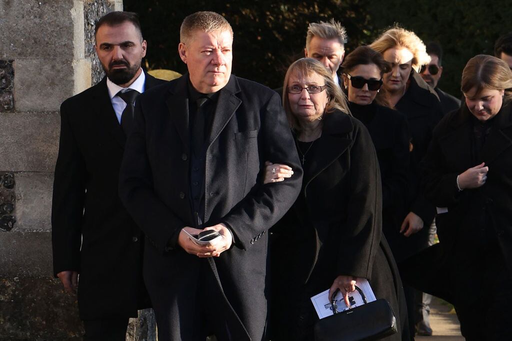 Karen Payne and Geoff Payne, parents of Liam, and Cheryl Tweedy leave following the funeral of singer Liam Payne, former member of One Direction, on November 20, 2024 in Amersham, United Kingdom. Former One Direction star Liam Payne’s private funeral in Amersham has been widely anticipated to draw celebrities and fans alike, wishing to pay their final respects. The singer died after falling from a hotel balcony in Buenos Aires on October 16. Dan Kitwood/Getty Images