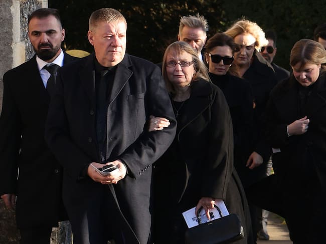 Karen Payne and Geoff Payne, parents of Liam, and Cheryl Tweedy leave following the funeral of singer Liam Payne, former member of One Direction, on November 20, 2024 in Amersham, United Kingdom. Former One Direction star Liam Payne’s private funeral in Amersham has been widely anticipated to draw celebrities and fans alike, wishing to pay their final respects. The singer died after falling from a hotel balcony in Buenos Aires on October 16. Dan Kitwood/Getty Images
