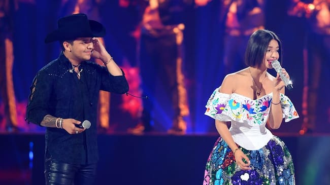 Christian Nodal and Angela Aguilar perform on stage during Premios Juventud 2019 at Watsco Center on July 18, 2019 in Coral Gables, Florida. Jason Koerner/Getty Images