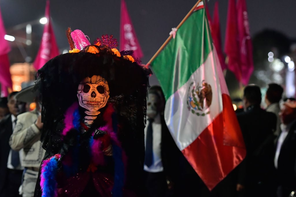 People dresseded as Catrinas and Catrines took to the historic center of Toluca to participate in the traditional of the Day of the Dead parade. Arturo Hernandez/Getty Images.