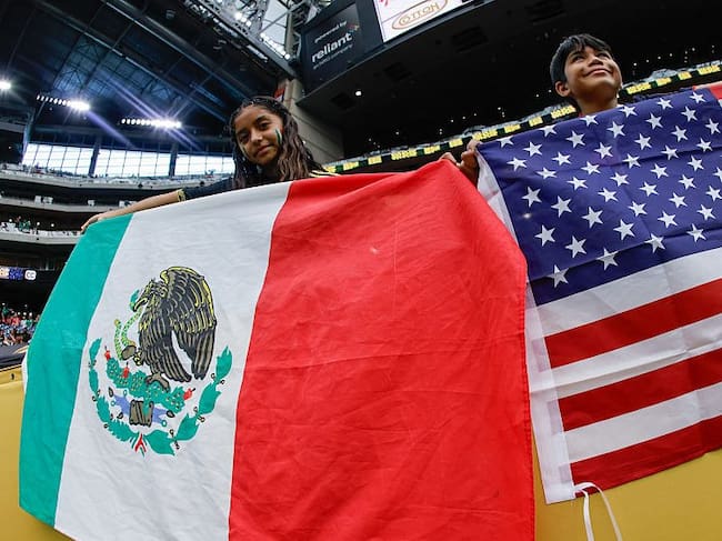 Fans hold the Mexican and American flags prior to the United States playing Mexico during the finals of the CONCACAF Gold Cup 2025 on July 06, 2025 in Houston, Texas. (Ron Jenkins/Getty Images)