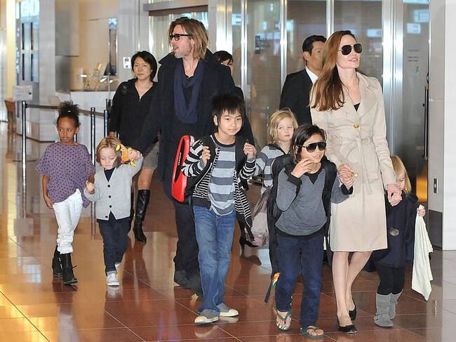 Brad Pitt, Angelina Jolie and their six children Maddox, Pax, Zahara, Shiloh, Knox, and Vivienne in Tokyo, Japan. Jun Sato/Getty Images.