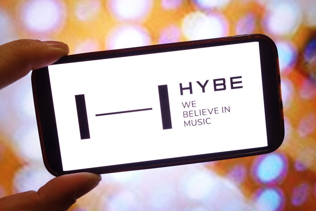 In this photo illustration, the Hybe company logo is seen displayed on a smartphone screen. (Piotr Swat/Getty Images)