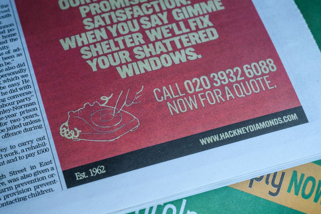 In this photo illustration, an advertisement for the «Hackney Diamonds Glass Repair» company is seen in a copy of the Hackney Gazette local free newspaper on August 23, 2023 in London, England. The Rolling Stones have hinted at the title of their upcoming 31st studio album, their first original work since 2005, through an advertisement for a fictional glass repair business in the Hackney Gazette. «Hackney Diamonds» is the local slang term for the pieces of shattered glass, found by the roadside. Leon Neal/Getty Images