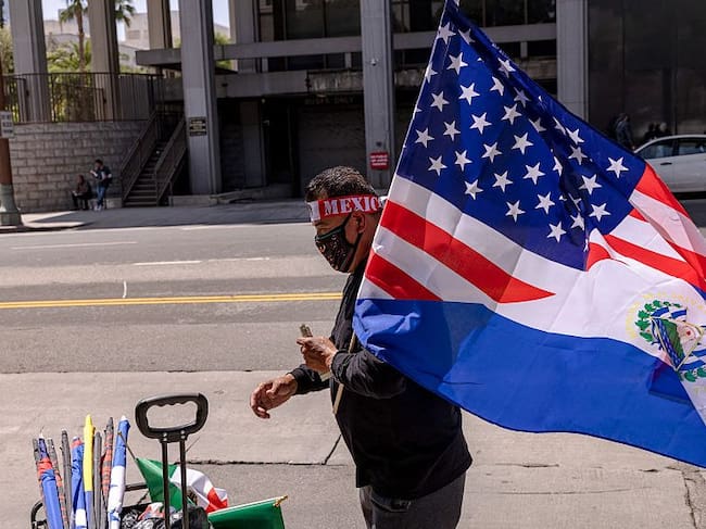 Hand seller sells flags of Mexico and the US as protesters continue anti-ICE demonstrations on the second day in Los Angeles, California, on June 7, 2025. (Sahab Zaribaf/Getty Images)