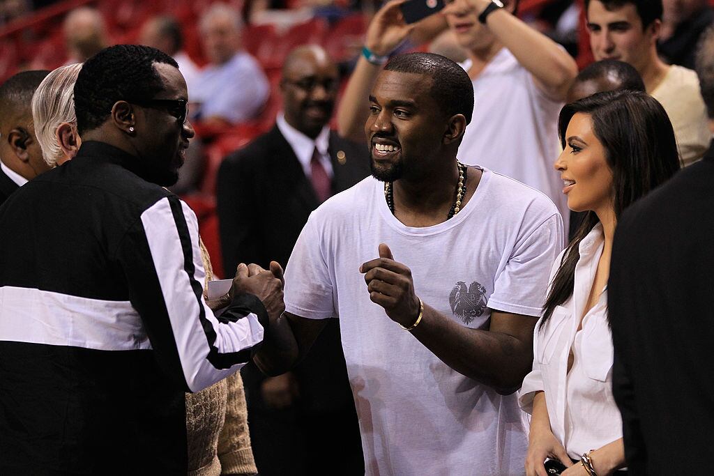 Sean P. Diddy Combs, Kanye West and Kim Kardashian attend the game between the New York Knicks and Miami Heat at American Airlines Arena on December 6, 2012 in Miami, Florida. NOTE TO USER: User expressly acknowledges and agrees that, by downloading and or using this photograph, User is consenting to the terms and conditions of the Getty Images License Agreement. Christopher Trotman/Getty Images