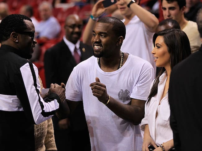 Sean P. Diddy Combs, Kanye West and Kim Kardashian attend the game between the New York Knicks and Miami Heat at American Airlines Arena on December 6, 2012 in Miami, Florida. NOTE TO USER: User expressly acknowledges and agrees that, by downloading and or using this photograph, User is consenting to the terms and conditions of the Getty Images License Agreement. Christopher Trotman/Getty Images
