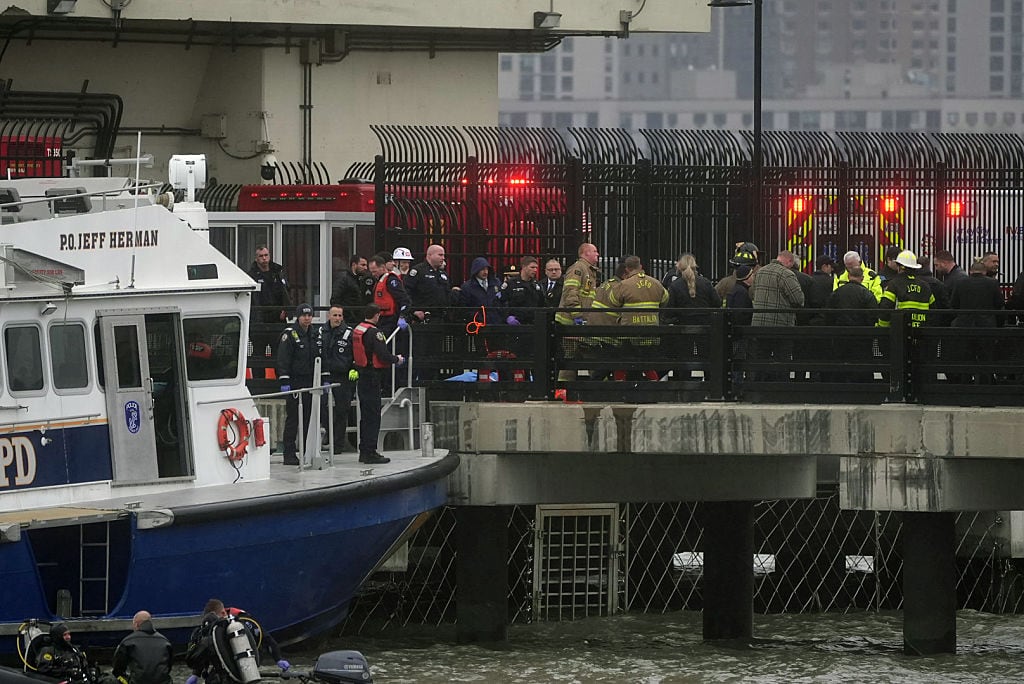 Police and firefighters work on the site after a helicopter crashed into the Hudson River near lower Manhattan, though casualties remain unknown on April 10, 2025 in New York, United States. Lokman Vural Elibol/Anadolu via Getty Images