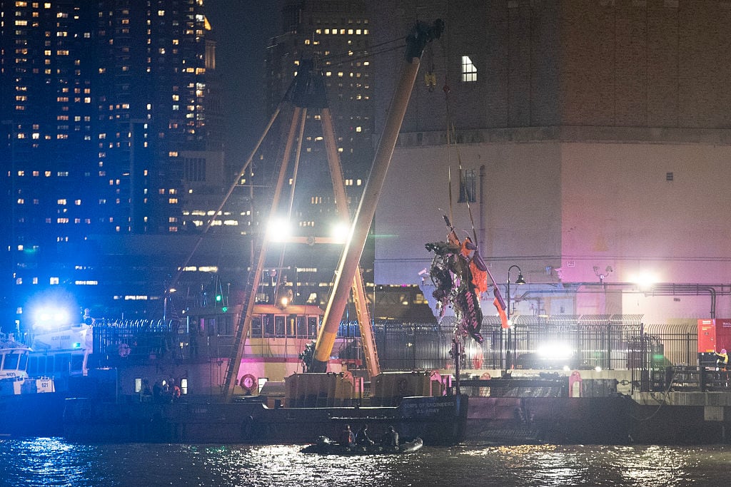 Rescuers work at the site of a helicopter crash on the Hudson River on April 10, 2025 in Hoboken, New Jersey. A helicopter crashed into the Hudson River around Pier 40 in Manhattan, New York City, on April 10 killing all the six people on board, said New York City Mayor Eric Adams at a press conference. Liao Pan/China News Service/VCG via Getty Images