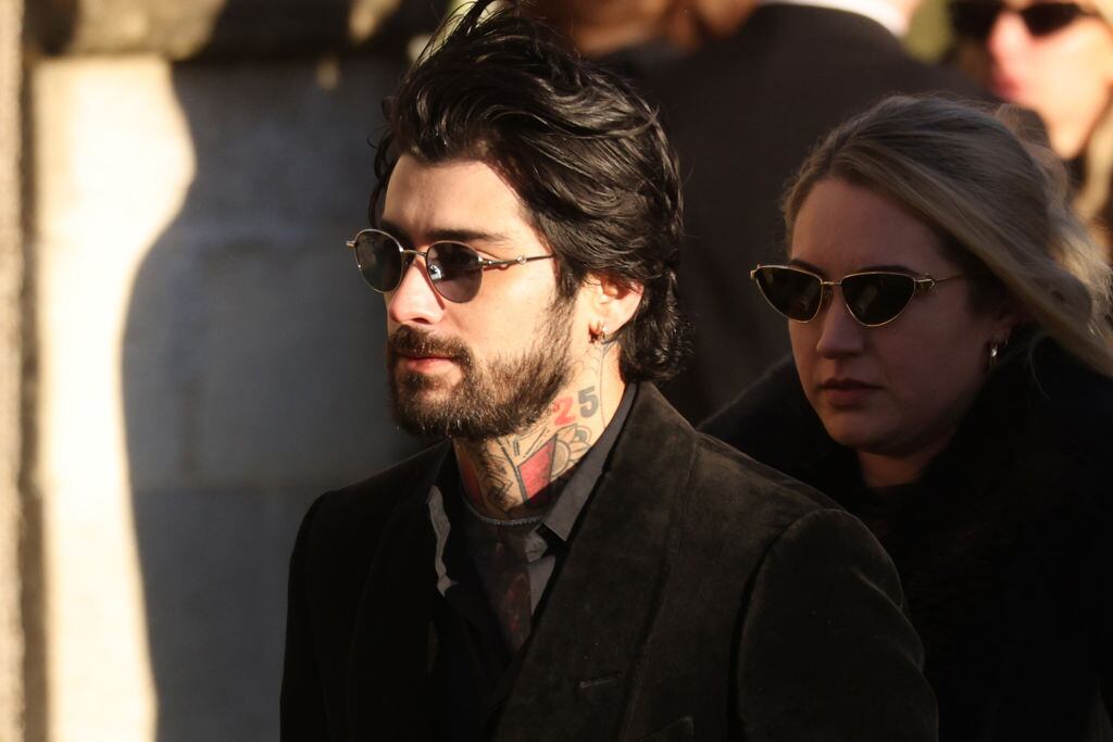AMERSHAM, ENGLAND – NOVEMBER 20: Former One Direction band member Zayn Malik leaves following the funeral of singer Liam Payne, former member of One Direction, on November 20, 2024 in Amersham, United Kingdom. Former One Direction star Liam Payne’s private funeral in Amersham has been widely anticipated to draw celebrities and fans alike, wishing to pay their final respects. The singer died after falling from a hotel balcony in Buenos Aires on October 16. (Photo by Dan Kitwood/Getty Images)