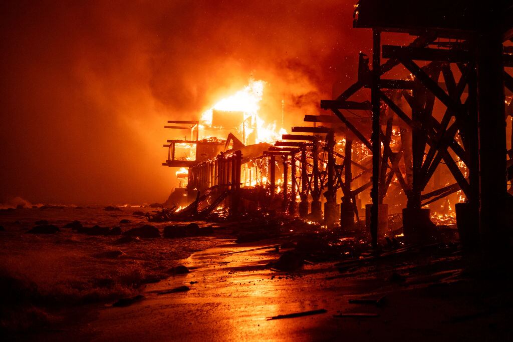 Beachfront homes go up in flames along Pacific Coast Highway in Malibu in the Palisades Fire on Tuesday, January 7, 2025. David Crane/MediaNews Group/Los Angeles Daily News via Getty Images
