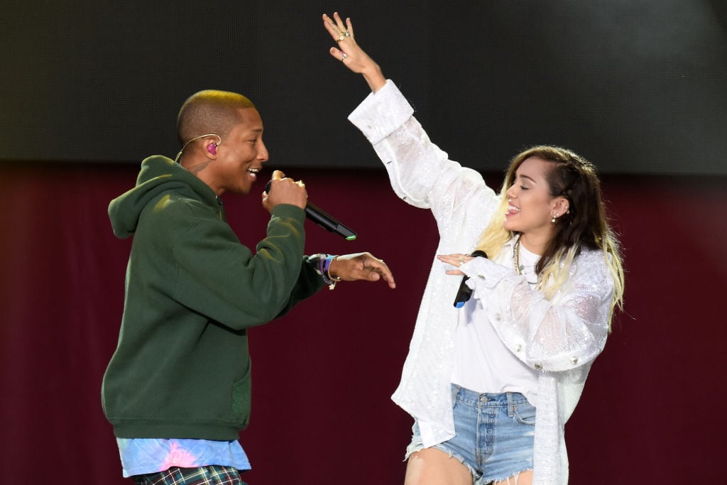 Pharrell Williams and Miley Cyrus perform on stage on June 4, 2017 in Manchester, England. Getty Images/Dave Hogan for One Love Manchester