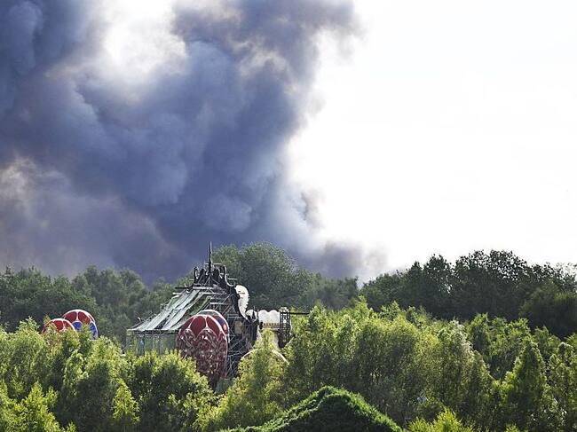 Smoke caused by a fire pictured at the festival site of the Tomorrowland electronic music festival, Wednesday 16 July 2025, in Boom. The first weekend of the festival takes place at the ‘De Schorre’ terrain in Boom, from 18 to 20 July. BELGA PHOTO TOM GOYVAERTS (Photo by Tom Goyvaerts / BELGA MAG / Belga via AFP) (Photo by TOM GOYVAERTS/BELGA MAG/AFP via Getty Images)