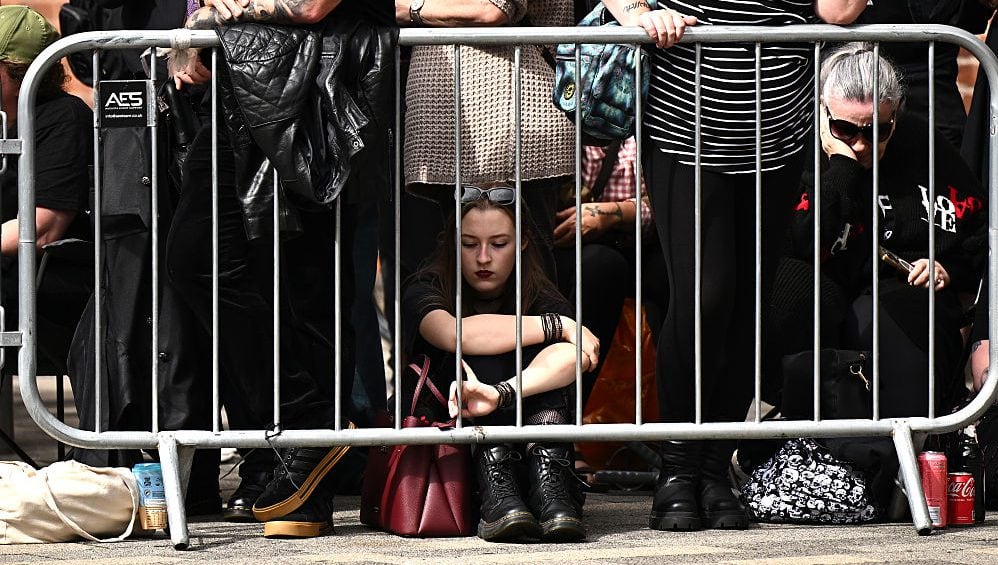Fans wait for Ozzy Osbourne’s funeral cortege to travel through his home city of Birmingham on July 30, 2025 in Birmingham, England. (Leon Neal/Getty Images)