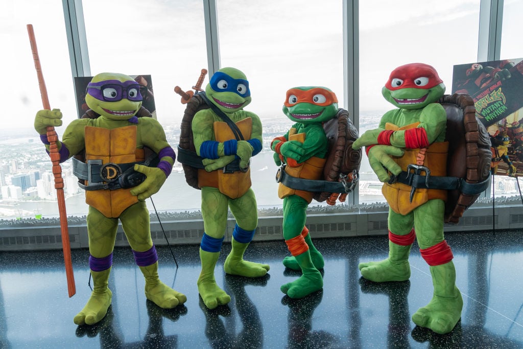 Teenage Mutant Ninja Turtles characters Raphael, Michelangelo, Donatello and Leonardo visit One World Observatory and pose with visitors in anticipation of release of «Teenage Mutant Ninja Turtles: Mutant Mayhem». Lev Radin/Pacific Press/Getty Images.
