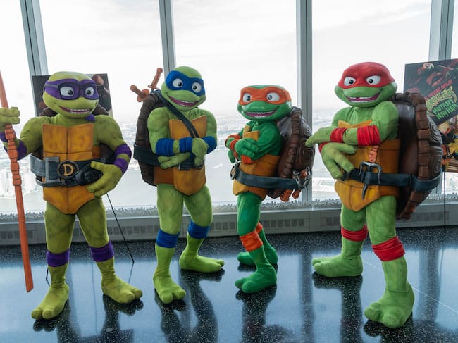 Teenage Mutant Ninja Turtles characters Raphael, Michelangelo, Donatello and Leonardo visit One World Observatory and pose with visitors in anticipation of release of «Teenage Mutant Ninja Turtles: Mutant Mayhem». Lev Radin/Pacific Press/Getty Images.