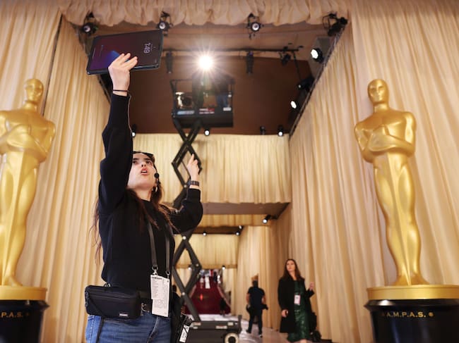 Lighting director Jay Koch preps for the Oscars outside of the Dolby Theater in Hollywood on March 1, 2025. Christina House / Los Angeles Times via Getty Images