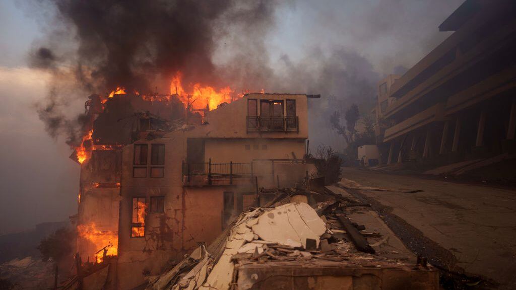 Flames from the Palisades Fire burn a structure on January 8, 2025 in Malibu, California. Fueled by intense Santa Ana Winds, the Palisades Fire has grown to over 2,900 acres and 30,000 people have been ordered to evacuate while a second major fire continues to burn near Eaton Canyon in Altadena. Eric Thayer/Getty Images