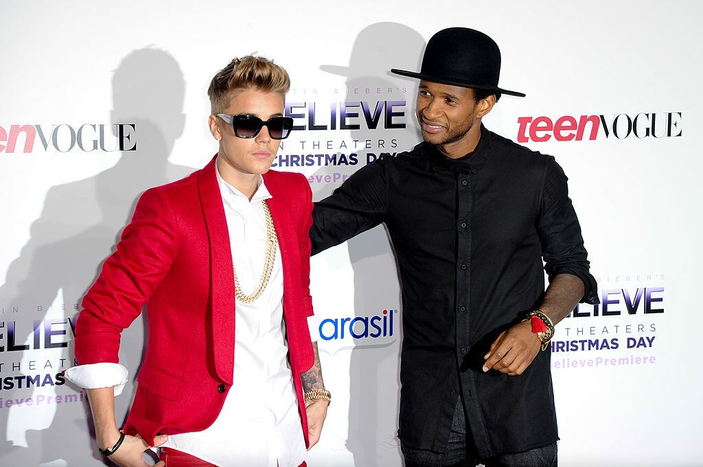Justin Bieber and Usher attend the premiere of Open Road Films’ ‘Justin Bieber’s Believe’ at Regal Cinemas L.A. Live on December 18, 2013 in Los Angeles, California. Allen Berezovsky/Getty Images
