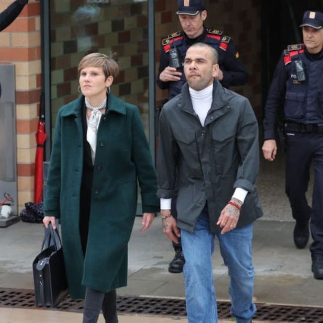 Dani Alves (R), flanked by his lawyer Ines Guardiola, leaves Brians 2 prison in San Esteban Sasroviras, near Barcelona, on March 25, 2024, after posting the one-million-euro bail set by a Barcelona court to ensure his release pending appeal. Alves was previously sentenced to 4.5 years in jail for rape on February 22, 2024. LLUIS GENE / AFP