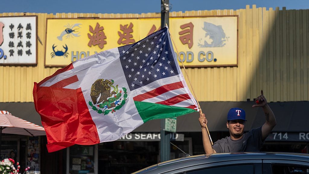 Protesters move through Chinatown as they continue to march and chant in Los Angeles in response to a series of immigration raids. June 11, 2025 in Los Angeles, California. David McNew/Getty Images
