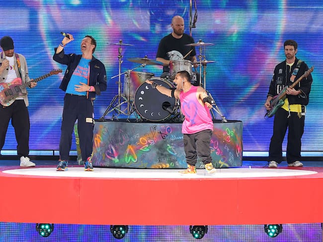 Coldplay and Australian singer Emmanuel Kelly perform during the halftime show of the FIFA Club World Cup 2025 final football match between England’s Chelsea and France’s Paris Saint-Germain at the MetLife Stadium in East Rutherford, New Jersey on July 13, 2025. CHARLY TRIBALLEAU / AFP