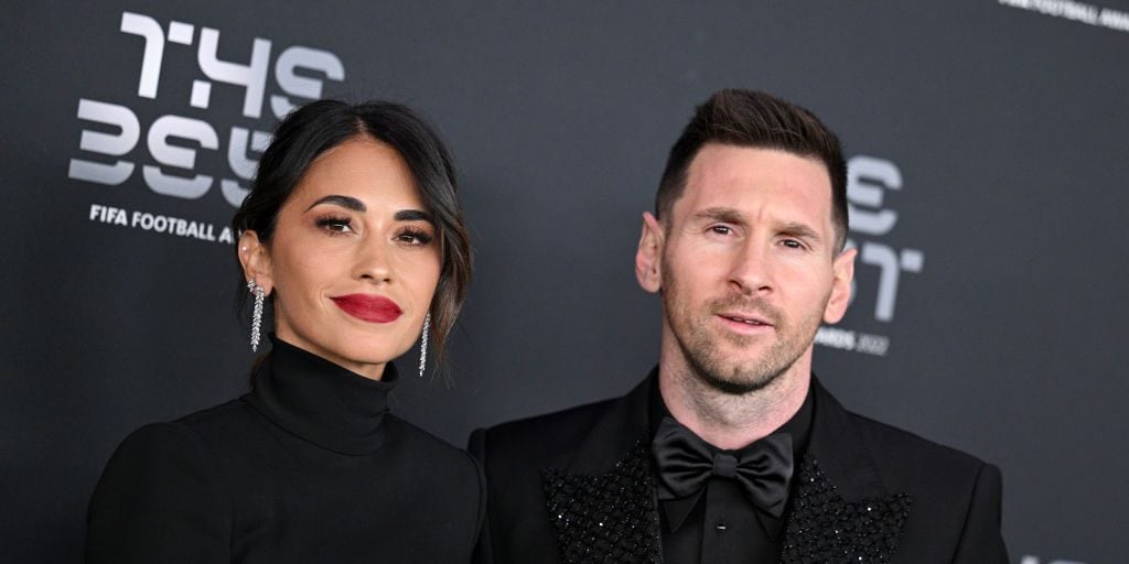 Antonella Roccuzzo and Lionel Messi pose for a photo on the Green Carpet ahead of The Best FIFA Football Awards 2022 on February 27, 2023 in Paris, France. Lionel Hahn/Getty Images