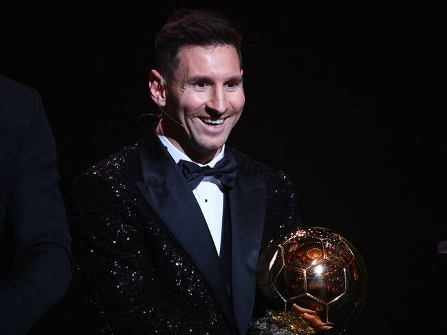 Paris Saint-Germain's Argentine forward Lionel Messi poses after being awarded the the Ballon d'Or award during the 2021 Ballon d'Or France Football award ceremony at the Theatre du Chatelet in Paris on November 29, 2021. (Photo by FRANCK FIFE / AFP) (Photo by FRANCK FIFE/AFP via Getty Images)