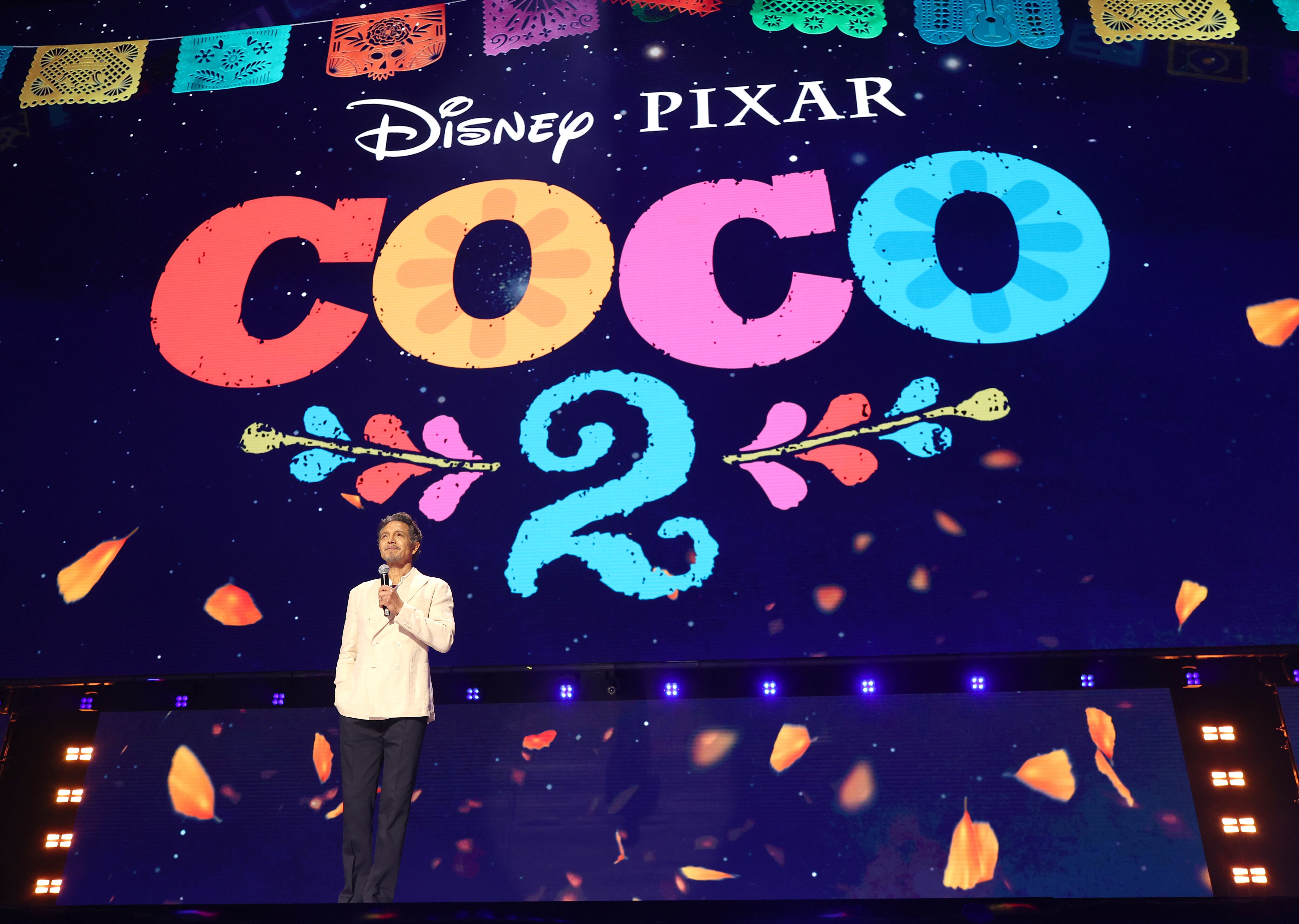 ANAHEIM, CALIFORNIA - AUGUST 14: Benjamin Bratt speaks onstage at the Disney Entertainment Showcase at D23: The Ultimate Disney Fan Event on August 14, 2026 in Anaheim, California. (Photo by Kevin Mazur/Getty Images for Disney)