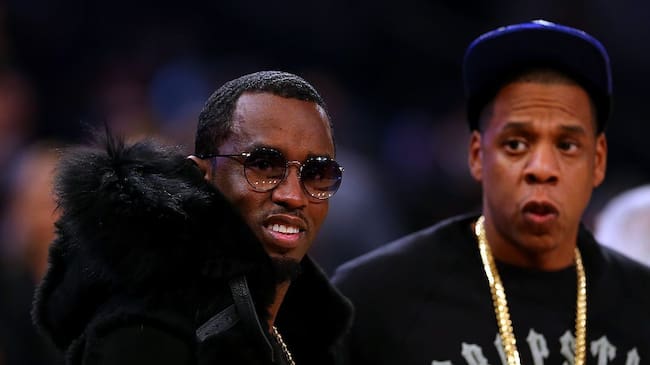 Rappers Sean Combs and Jay Z attend the 2015 NBA All-Star Game at Madison Square Garden on February 15, 2015 in New York City. NOTE TO USER: User expressly acknowledges and agrees that, by downloading and/or using this photograph, user is consenting to the terms and conditions of the Getty Images License Agreement. Elsa/Getty Images