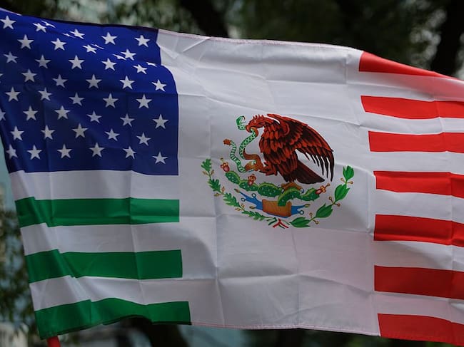 A view of a United States flag fused with the Mexican flag, which American citizens living in Mexico use to protest against US President Donald Trump, who since the beginning of his term orders the detention and mass deportation of migrants in the United States and border areas. (Gerardo Vieyra/Getty Images)