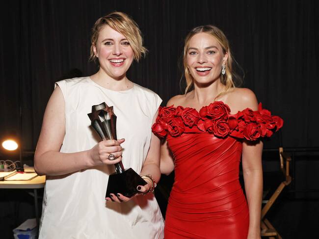 Greta Gerwig and Margot Robbie, winners of the Best Comedy Award for ‘Barbie,’ pose backstage during the 29th Annual Critics Choice Awards 2024 in Santa Monica, California. Kevin Mazur / Getty Images for Critics Choice Association