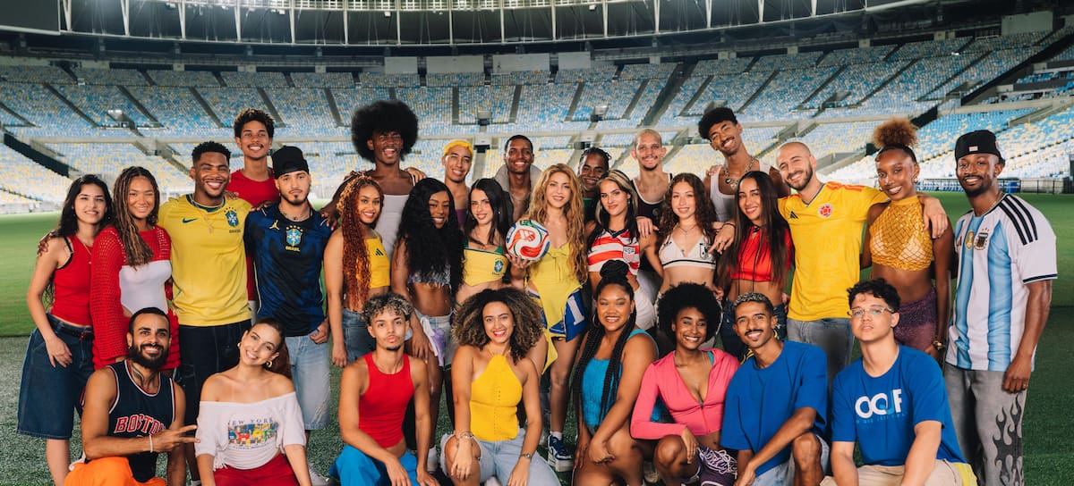 Shakira poses with her team on the set of the “Dai Dai” music video