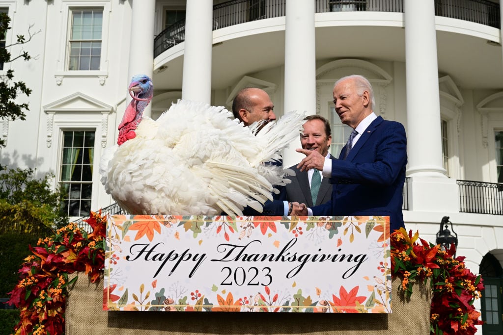 Jose Rojas and Steve Lykken, stand by National Thanksgiving Turkey, Liberty after President Joe Biden pardoned the turkey at the White House for the 76th National Thanksgiving Turkey Presentation on Monday November 20, 2023 in Washington, DC. The turkeys, are named Liberty and Bell. Matt McClain/Getty Images.