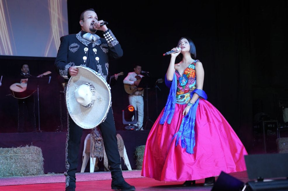 Pepe Aguilar (L) and Angela Aguilar perform onstage during Pepe Aguilar and Family ‘Jaripeo Sin Fronteras 2019’ on April 01, 2019 in Los Angeles, California. (Photo by JC Olivera/Getty Images)