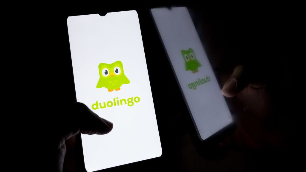 Smartphone showing Duolingo green logo