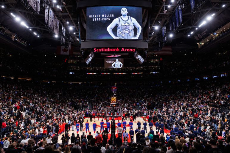 People take a moment of silence for former Toronto Raptor Oliver Miller ahead of their NBA game between the Toronto Raptors and the Philadelphia 76ers 