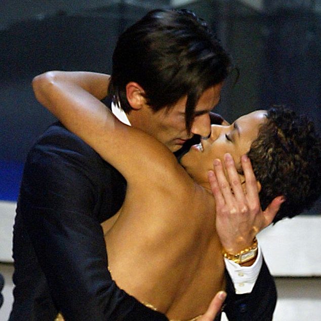 Actor Adrien Brody suprises presenter Halle Berry with a kiss