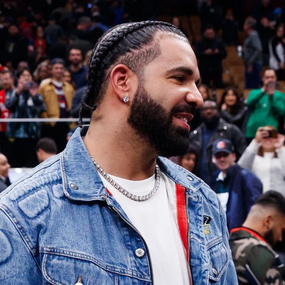 Rapper Drake greets Jayson Tatum #0 of the Boston Celtics after their NBA In-Season Tournament game against the Toronto Raptors at Scotiabank Arena