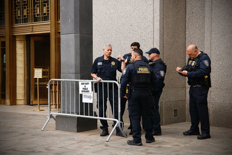 Homeland Security Officers gather outside the Southern District of New York Federal Court