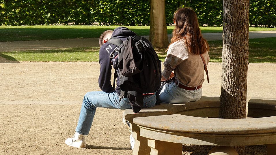 Couple In Tense Moment On Park Bench