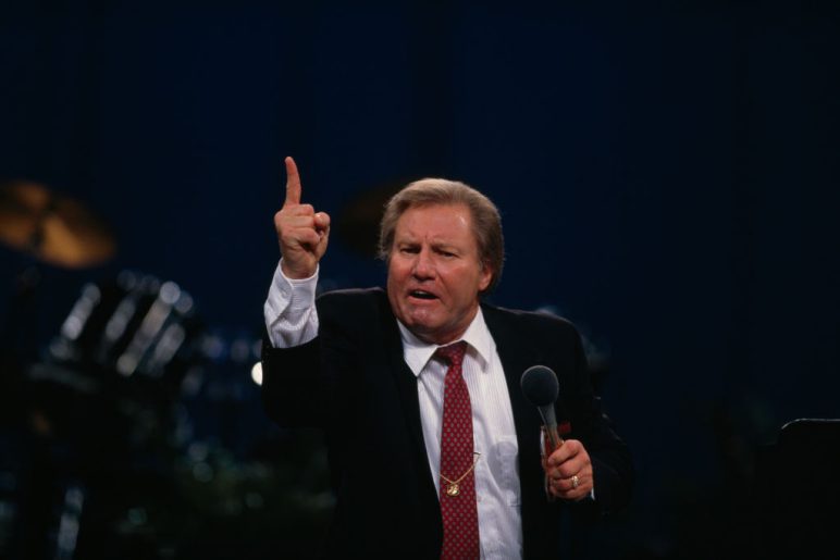 American television evangelist Jimmy Lee Swaggart haranguing his audience on stage
