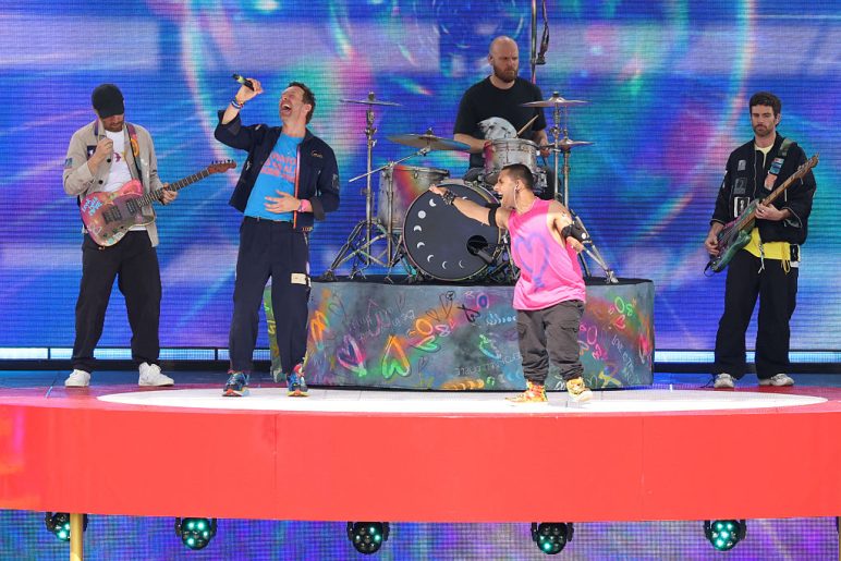 Coldplay and Australian singer Emmanuel Kelly perform during the halftime show of the FIFA Club World Cup 2025