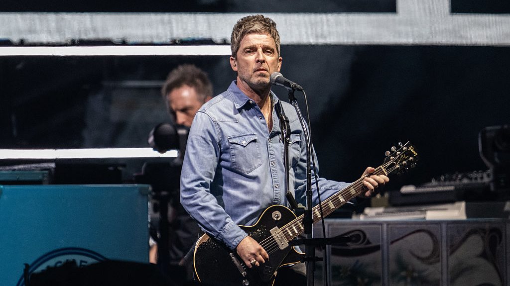 Noel Gallagher of Oasis performs on stage during the opening night of their Live 25' Tour at Principality Stadium on July 04